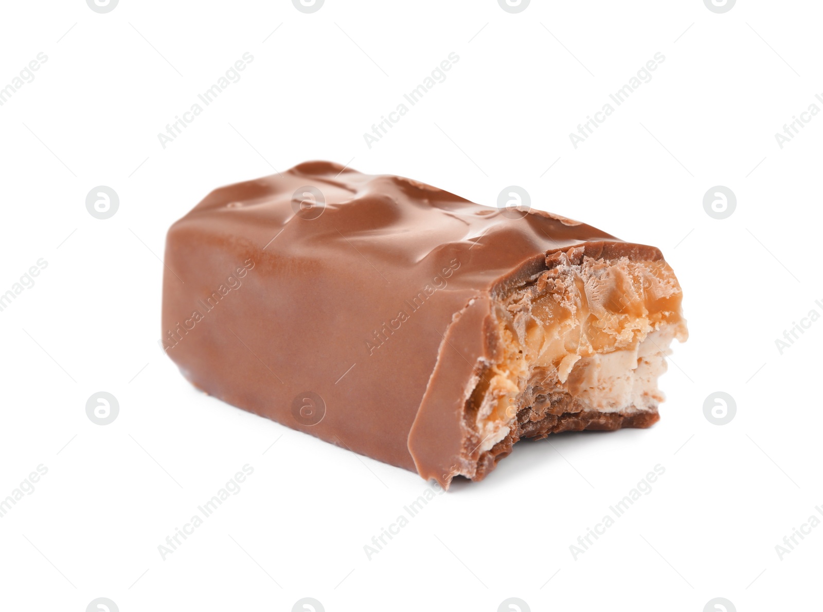 Photo of Piece of chocolate bar with caramel, nuts and nougat isolated on white