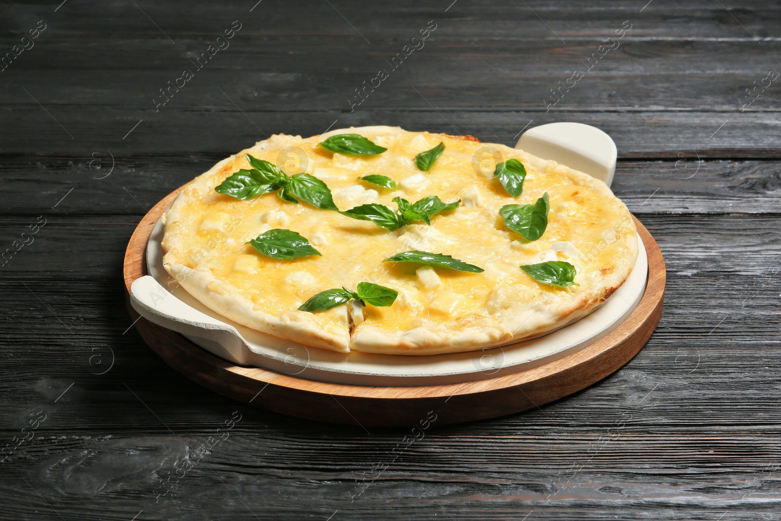 Photo of Fresh tasty homemade pizza on wooden table