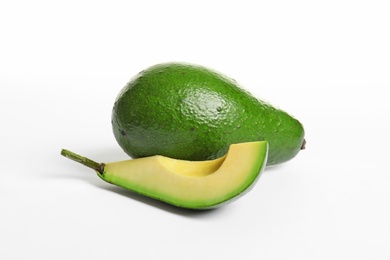 Ripe fresh avocados on white background