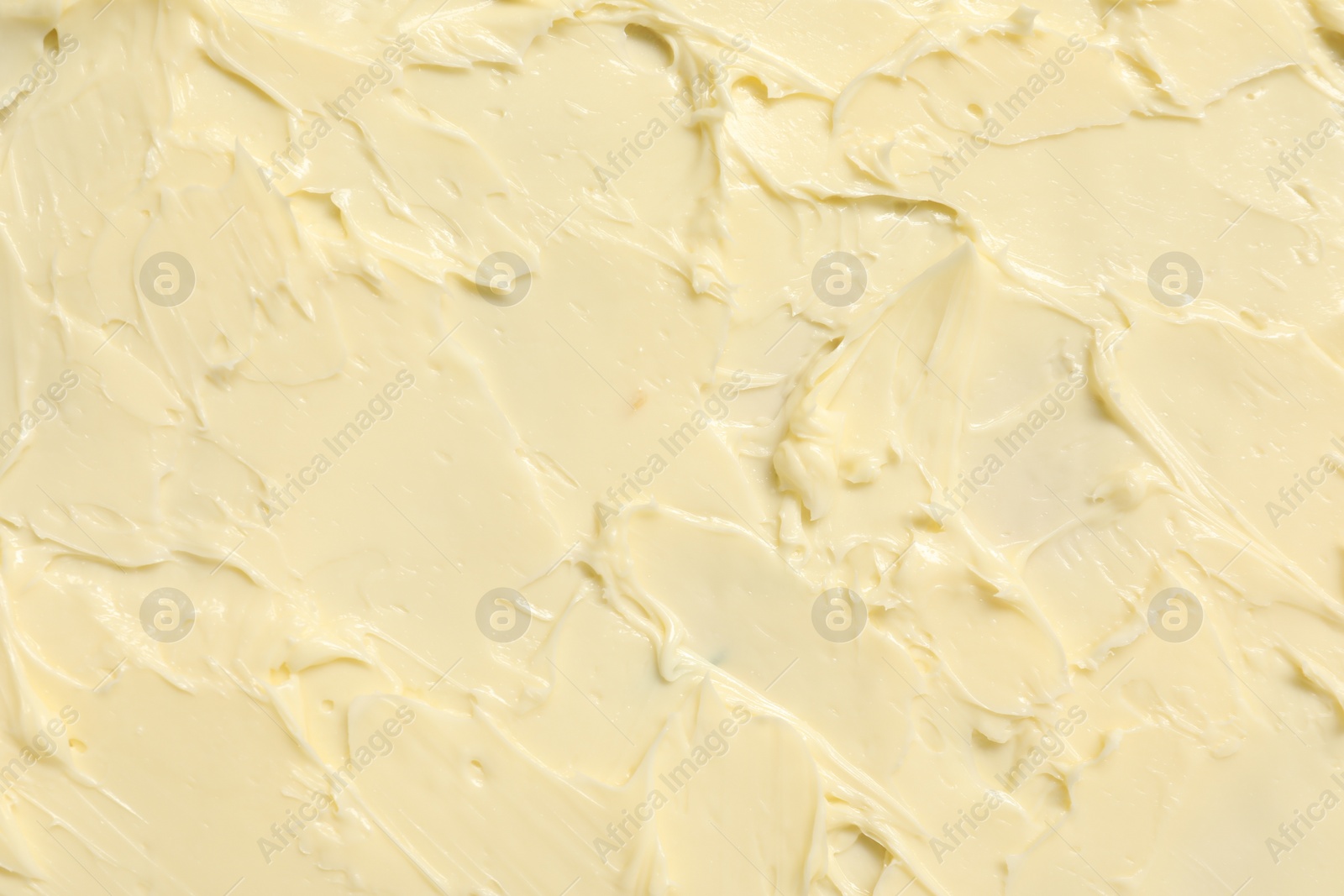 Photo of Texture of fresh natural butter as background, top view