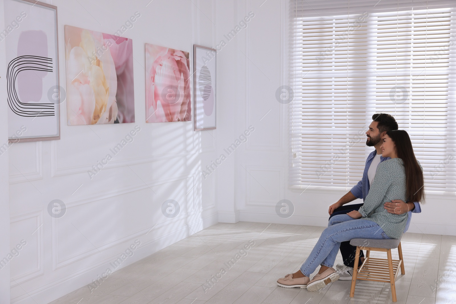 Photo of Lovely couple at exhibition in art gallery