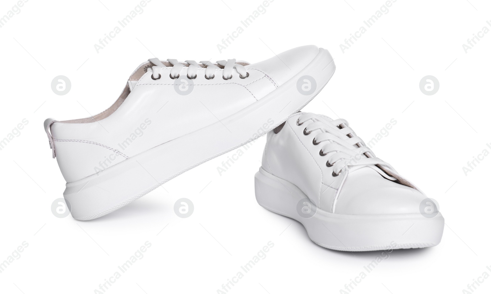 Photo of Pair of stylish sneakers isolated on white