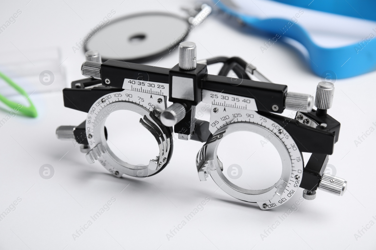 Photo of Trial frame on white background, closeup. Ophthalmologist tool