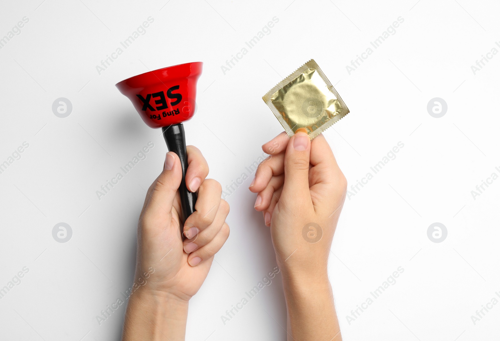 Photo of Woman with sex bell and condom on white background, top view