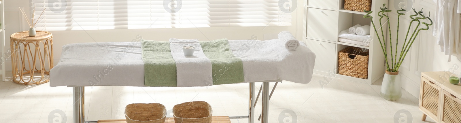 Image of Spa cabinet interior with massage table in wellness center. Banner design