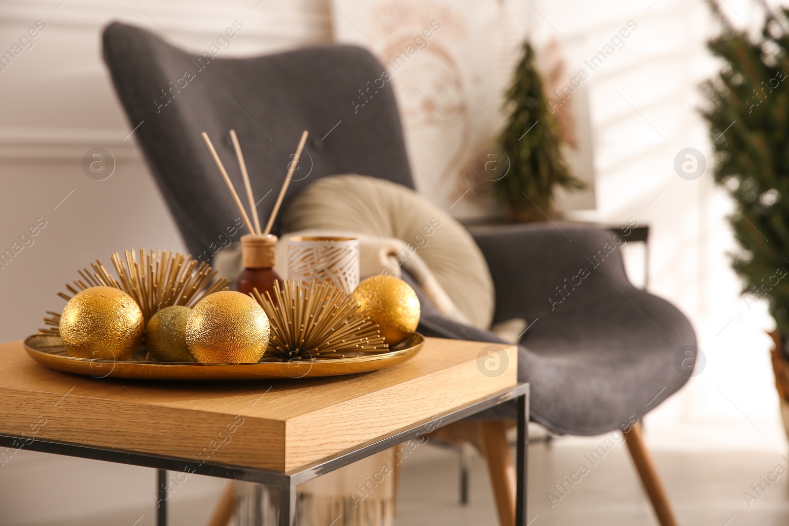 Photo of Elegant Christmas decor on table indoors. Interior design