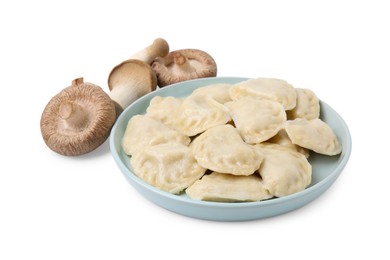 Photo of Plate of delicious dumplings (varenyky) and fresh mushrooms isolated on white