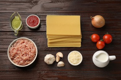 Ingredients for lasagna on wooden table, flat lay