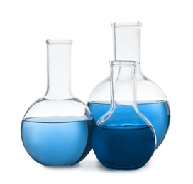 Boiling flasks with blue liquid isolated on white. Laboratory glassware