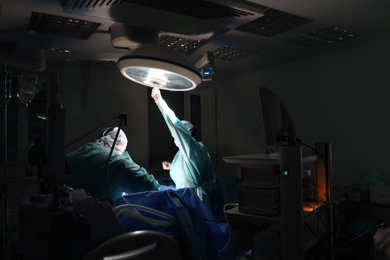 Photo of Medical team performing surgery in operating room
