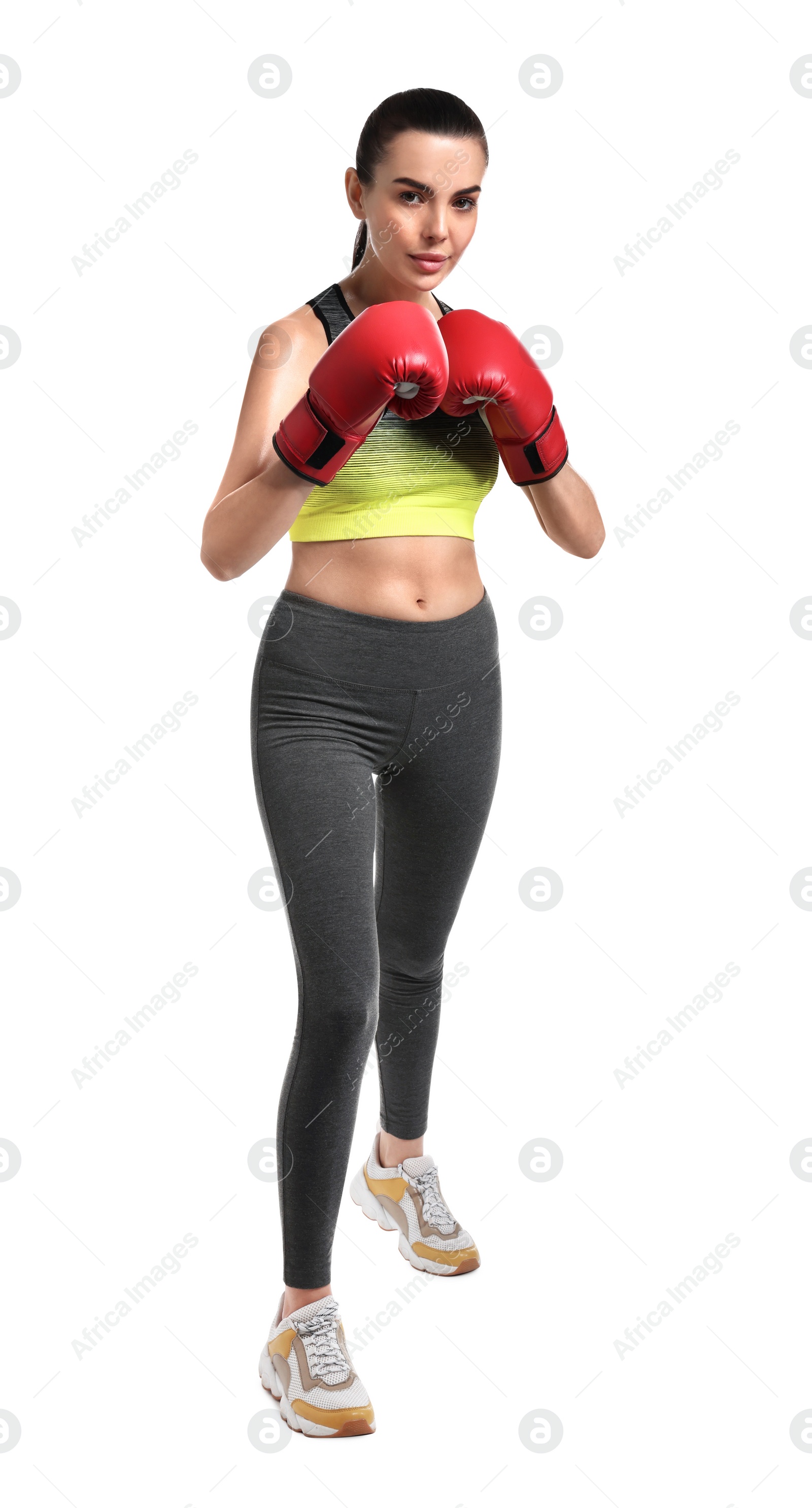 Photo of Beautiful woman in boxing gloves training on white background