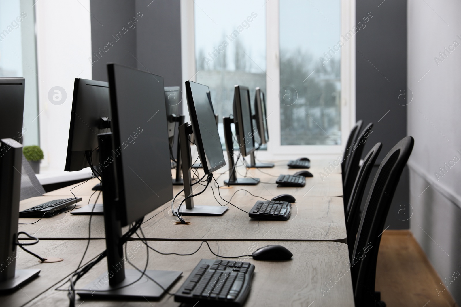 Photo of Many modern computers in open space office