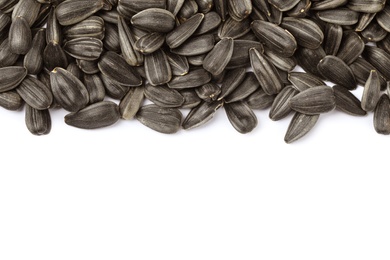 Photo of Raw sunflower seeds on white background, top view