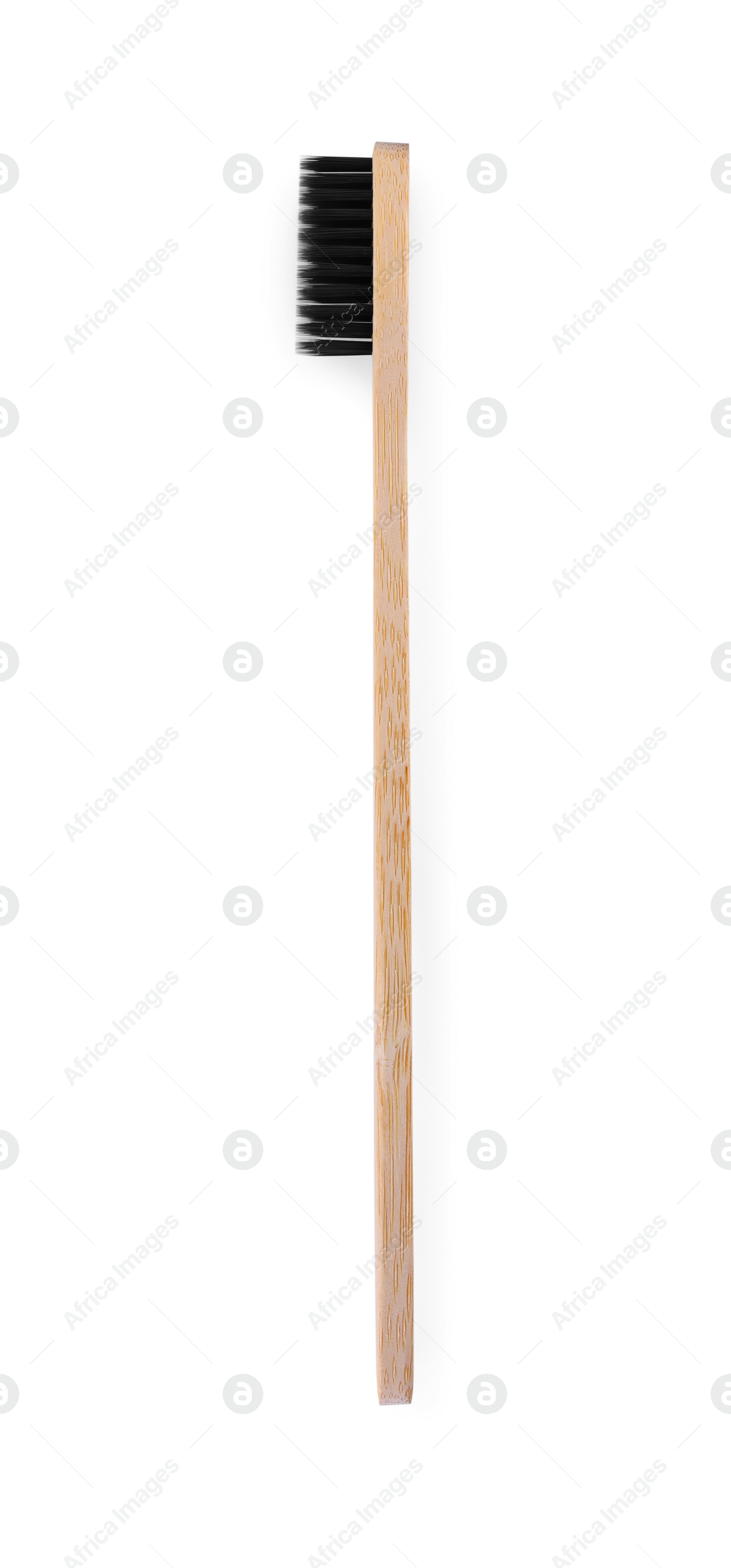 Photo of One bamboo toothbrush isolated on white, top view