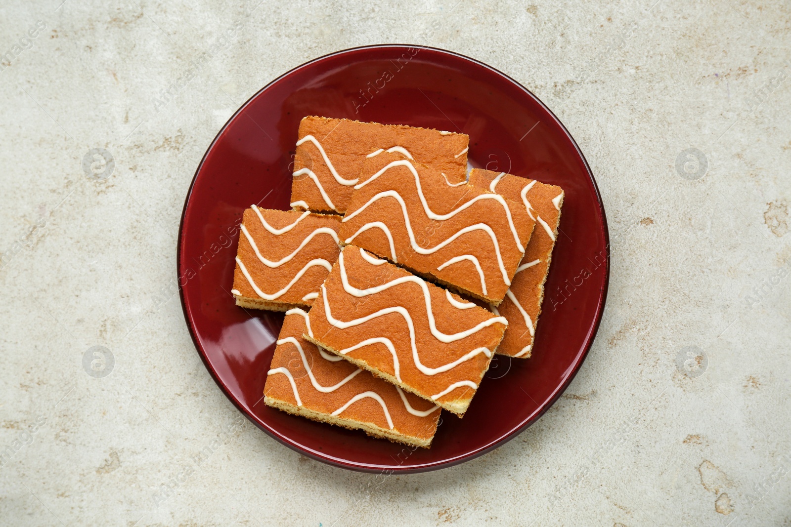 Photo of Tasty sponge cakes on light grey table, top view