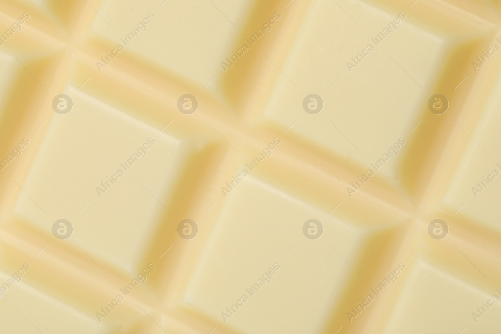 Photo of Delicious white chocolate as background, closeup view