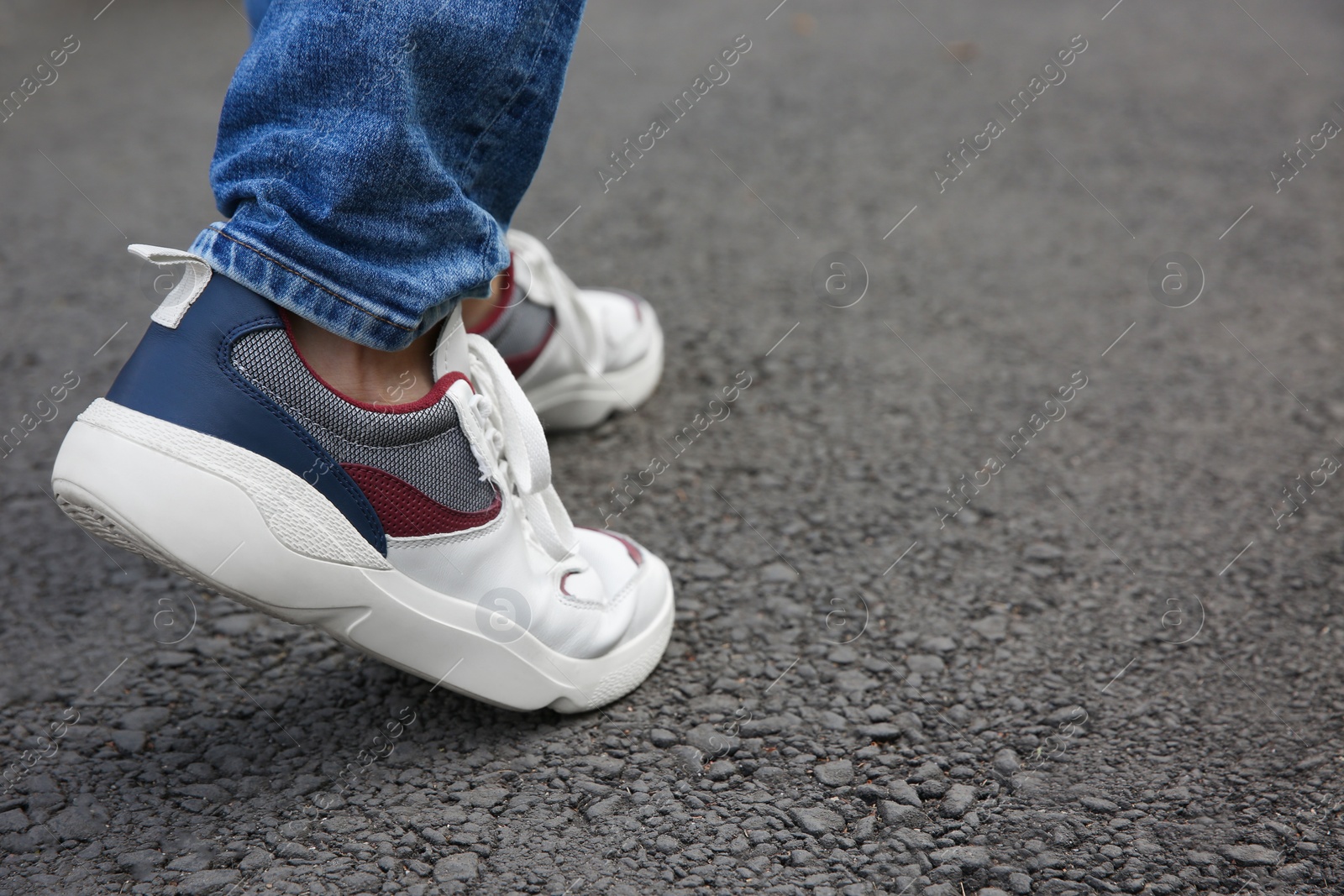 Photo of Man walking outdoors, closeup. Space for text