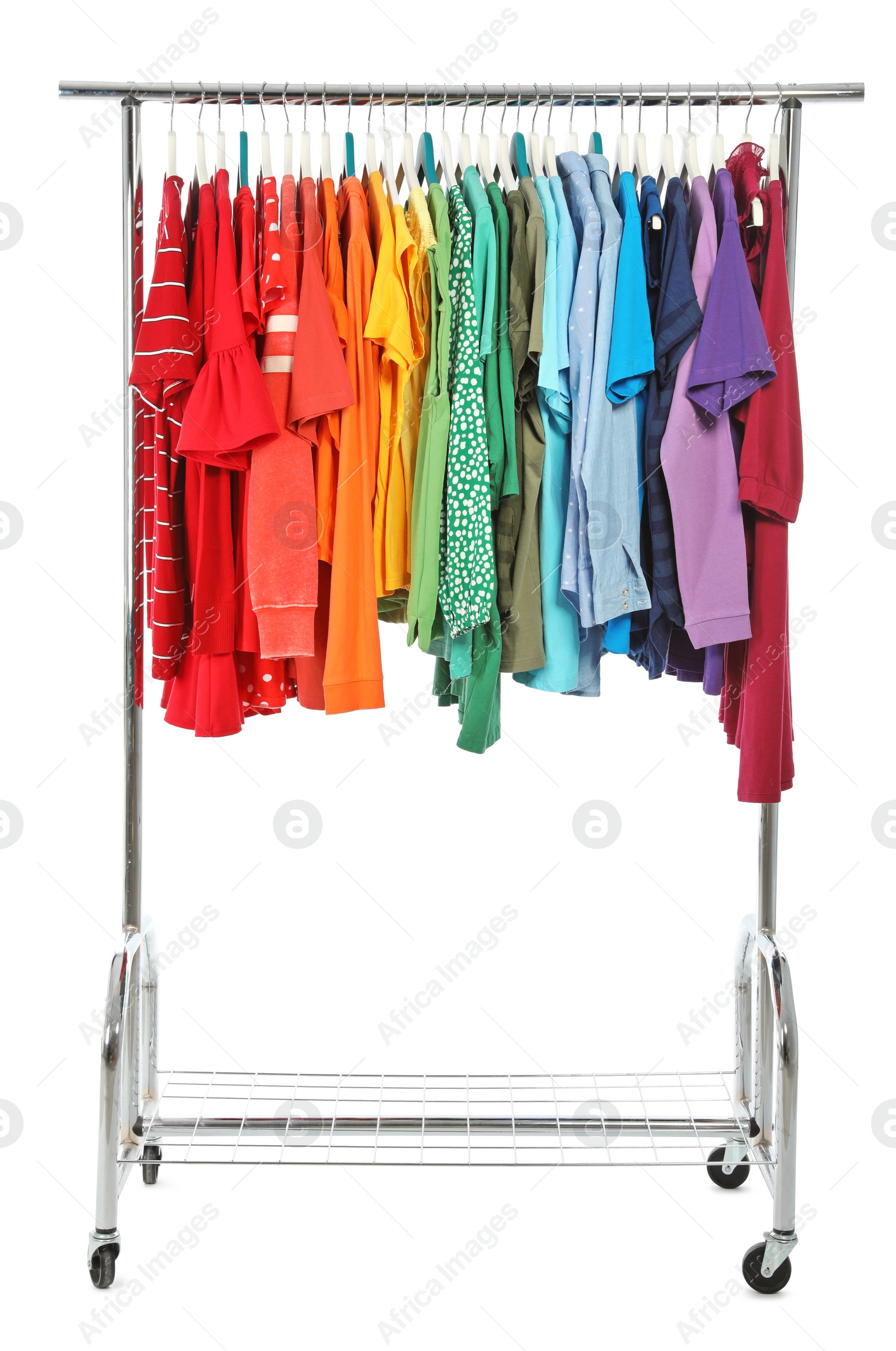 Photo of Wardrobe rack with different colorful clothes on white background