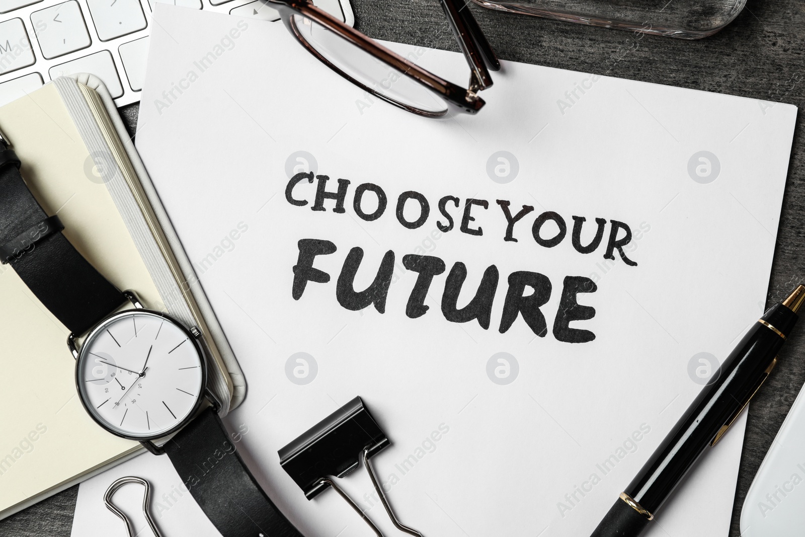 Photo of Flat lay composition with phrase CHOOSE YOUR FUTURE on grey stone background