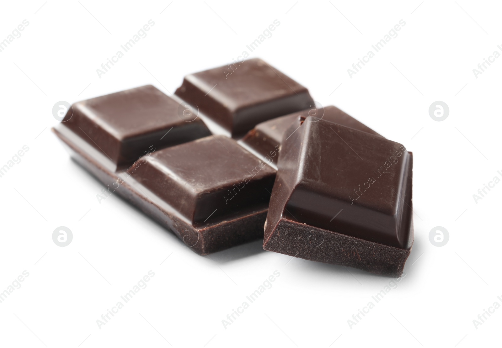 Photo of Pieces of delicious dark chocolate isolated on white