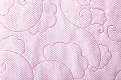 Photo of Toilet paper with pattern as background, closeup. Personal hygiene