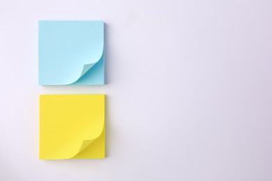 Photo of Blank paper notes on white background, flat lay. Space for text