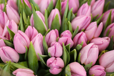 Photo of Beautiful bouquet of violet tulip flowers as background, closeup