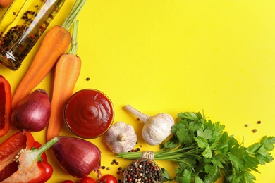 Photo of Flat lay composition with ingredients for cooking on yellow background. Space for text