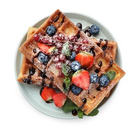 Photo of Delicious Belgian waffles with berries on white background, top view