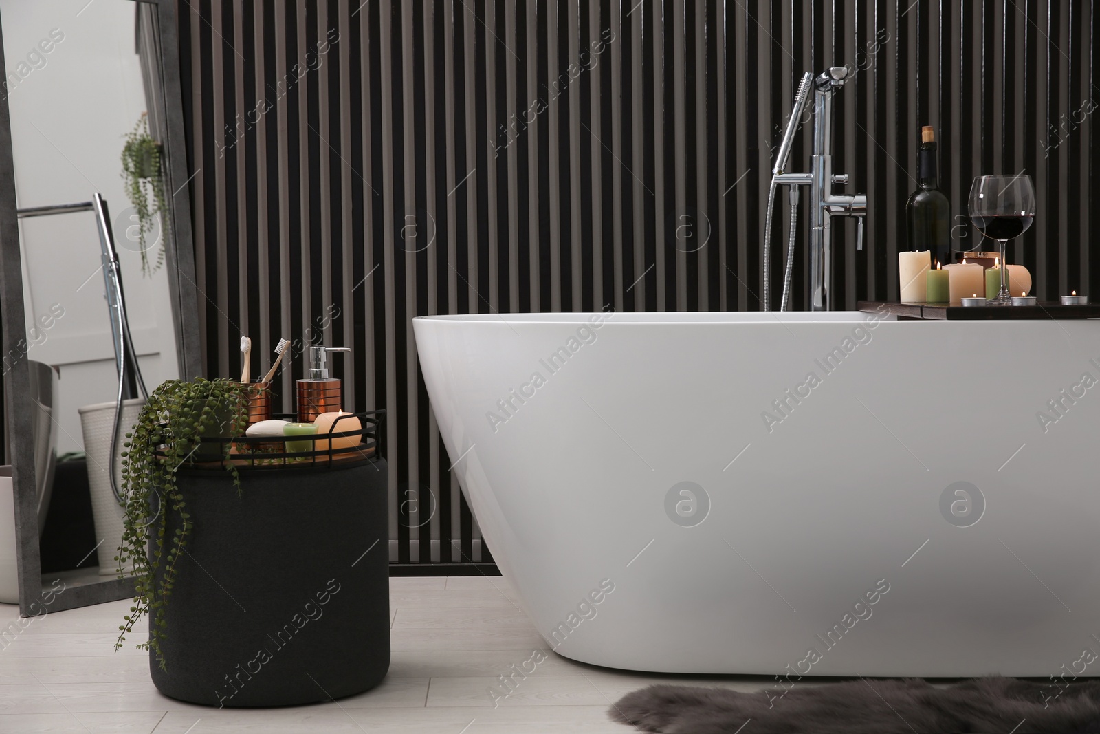 Photo of Stylish bathroom interior with modern white tub