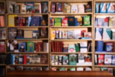 Photo of Blurred view of shelves with different library books as background