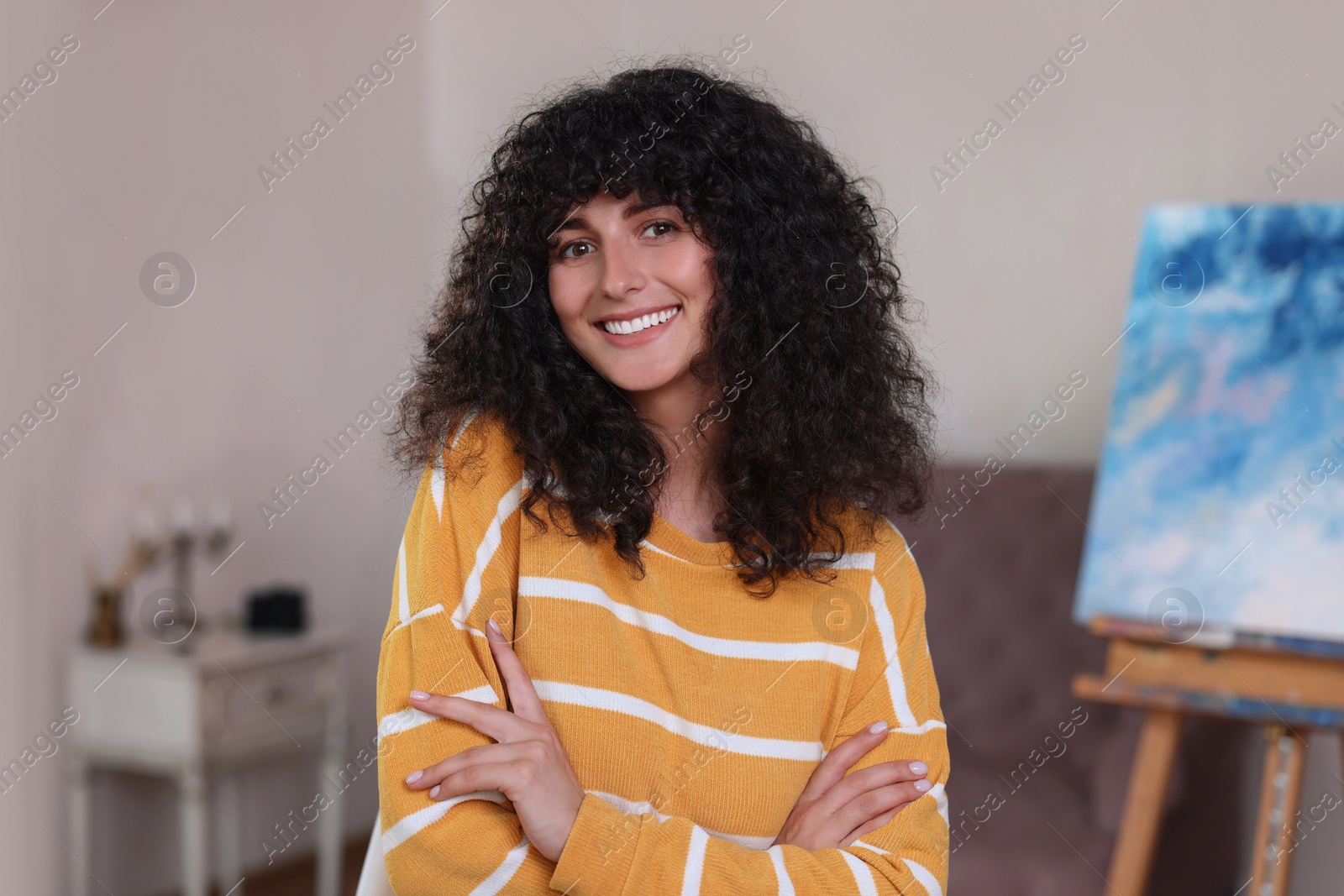 Photo of Portrait of happy young woman in stylish sweater indoors