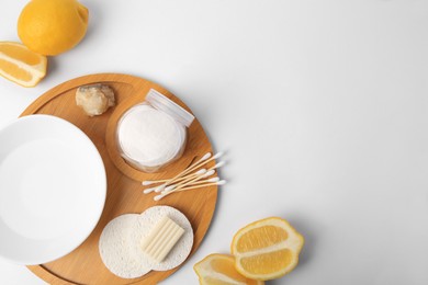 Photo of Lemon face wash. Fresh citrus fruits and personal care products on white background, flat lay with space for text