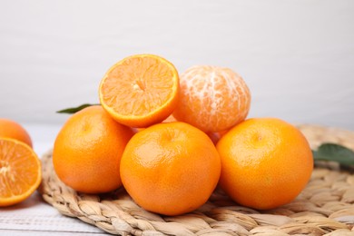 Photo of Fresh juicy tangerines on white wooden table