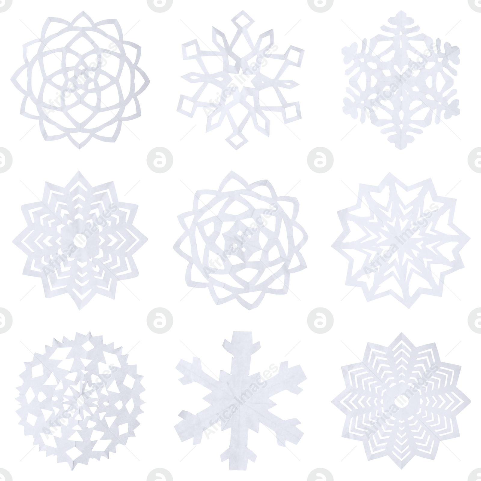 Image of Set of beautiful paper snowflakes on white background