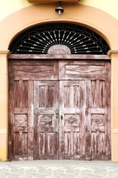 Photo of Exterior of building with old wooden gates