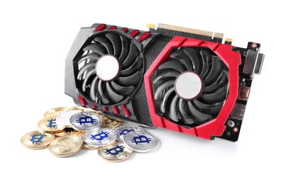 Photo of Modern video card and bitcoins isolated on white