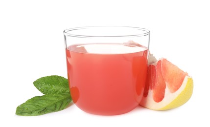 Photo of Glass of pink pomelo juice, fruit and green leaves isolated on white