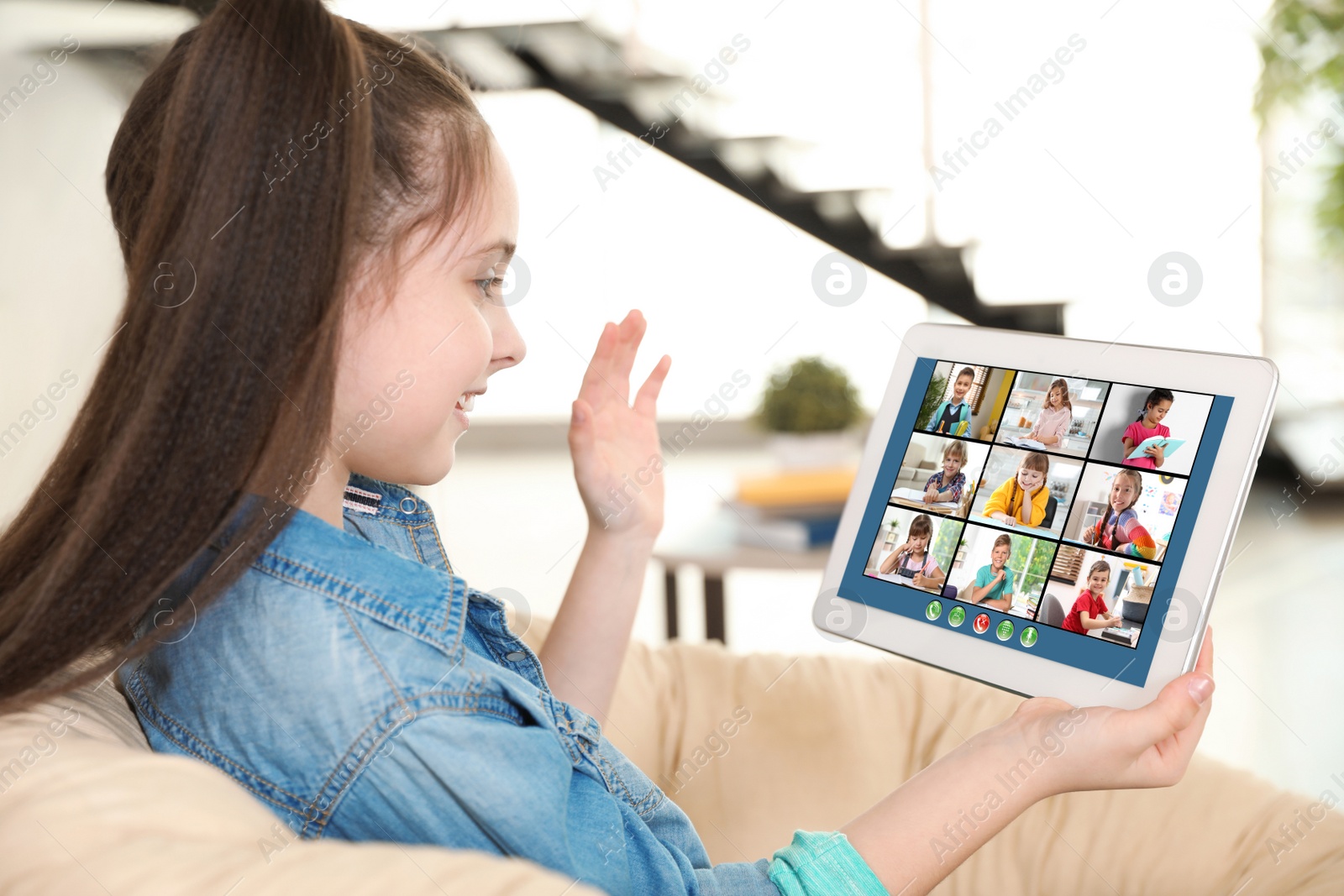 Image of Distance learning during quarantine and lockdown due to Covid-19 pandemic. Girl having online school lesson with class at home