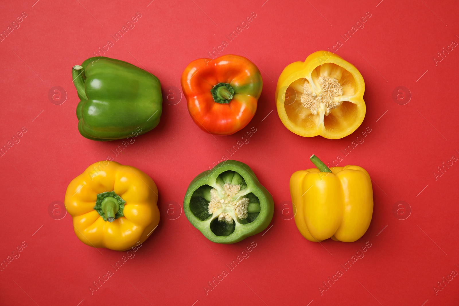 Photo of Flat lay composition with raw ripe paprika peppers on color background