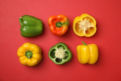 Flat lay composition with raw ripe paprika peppers on color background