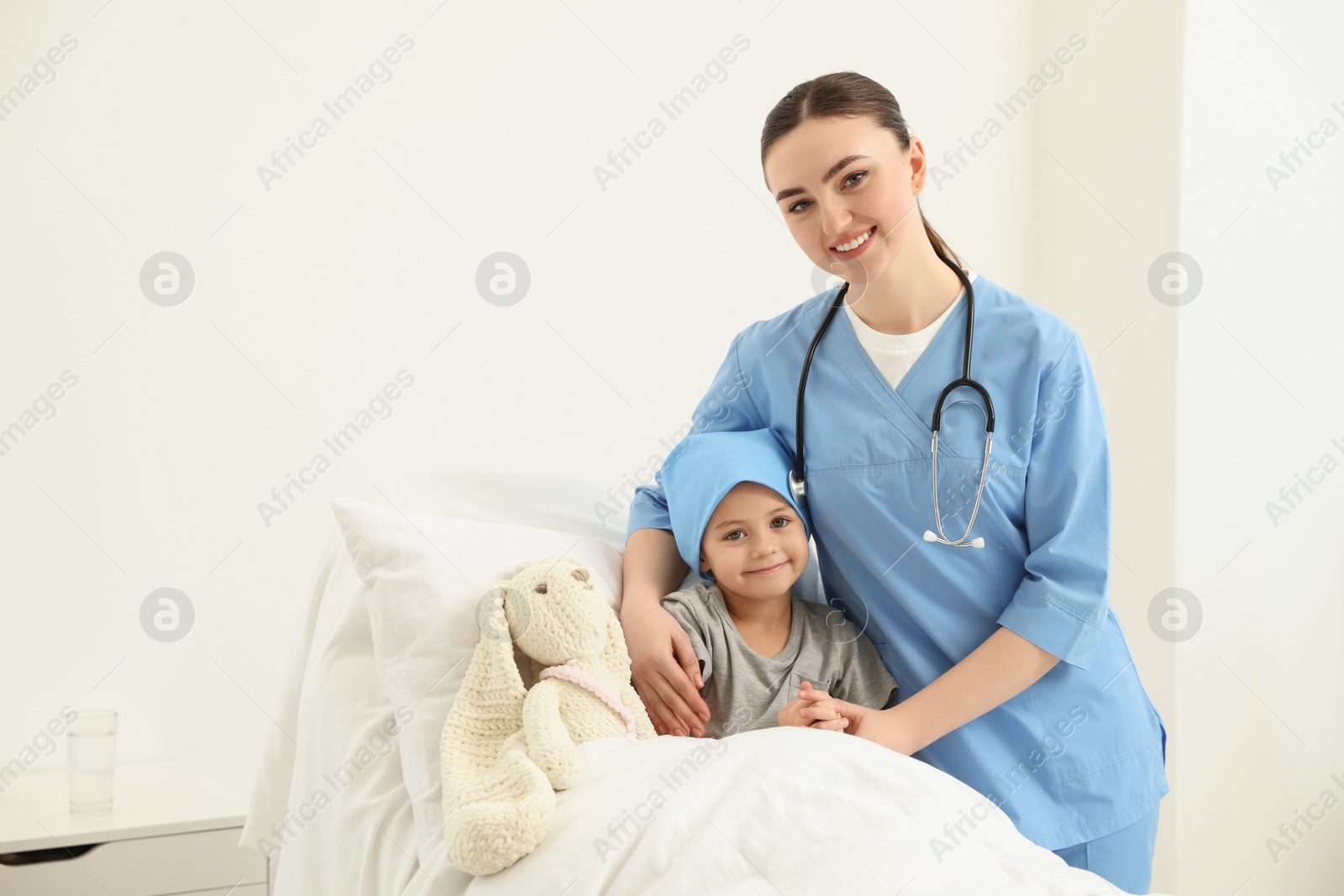 Photo of Childhood cancer. Doctor and little patient in hospital