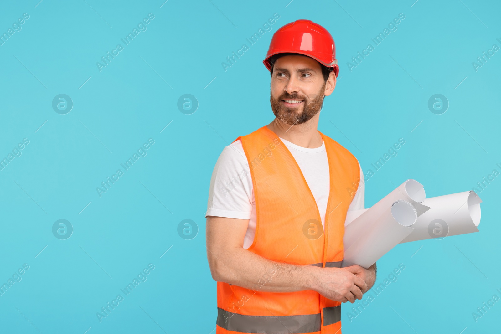 Photo of Architect in hard hat with drafts on light blue background, space for text