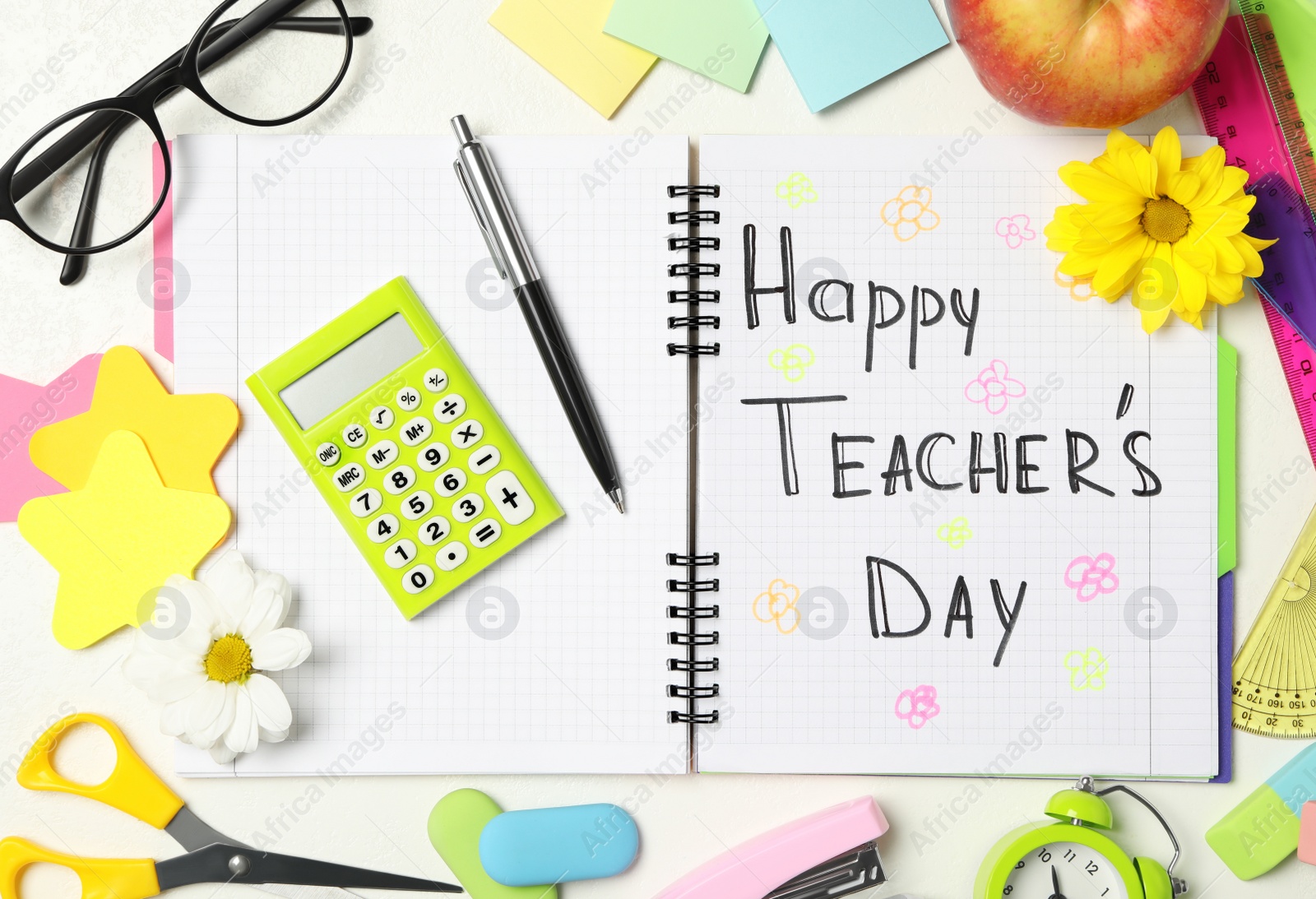 Photo of Flat lay composition with stationery and words TEACHER'S DAY on white background