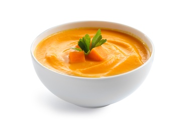 Delicious pumpkin cream soup in bowl on white background