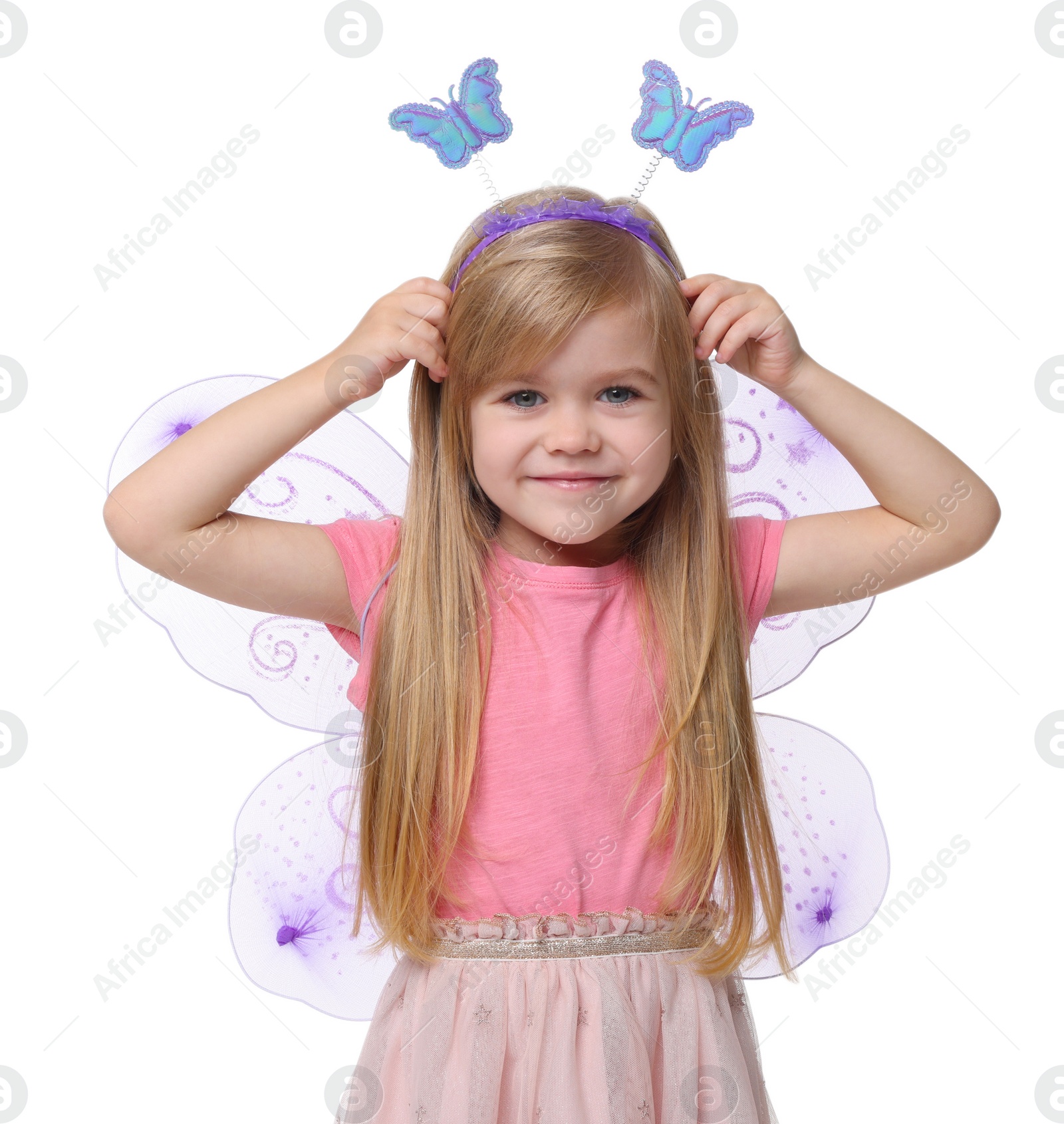 Photo of Cute little girl in fairy costume with violet wings on white background