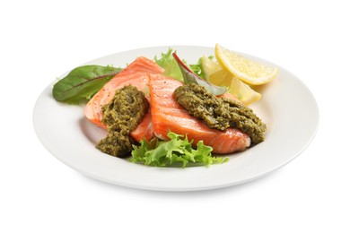 Photo of Tasty cooked salmon with pesto sauce on white background