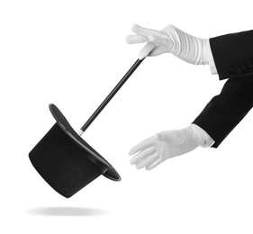 Magician showing trick with wand and top hat on white background, closeup