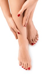 Woman with stylish red toenails after pedicure procedure isolated on white, top view