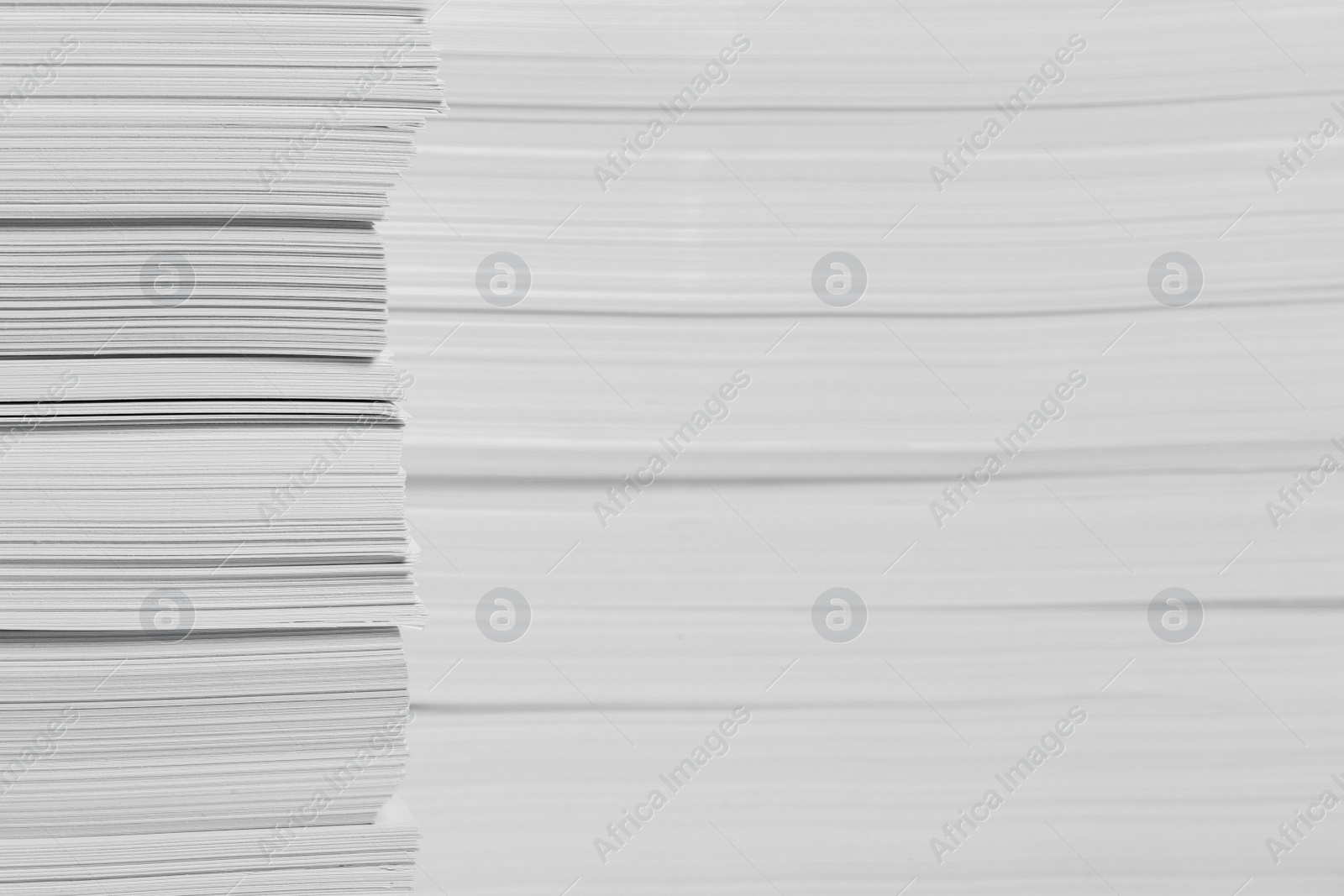 Photo of Stacks of paper sheets as background, closeup